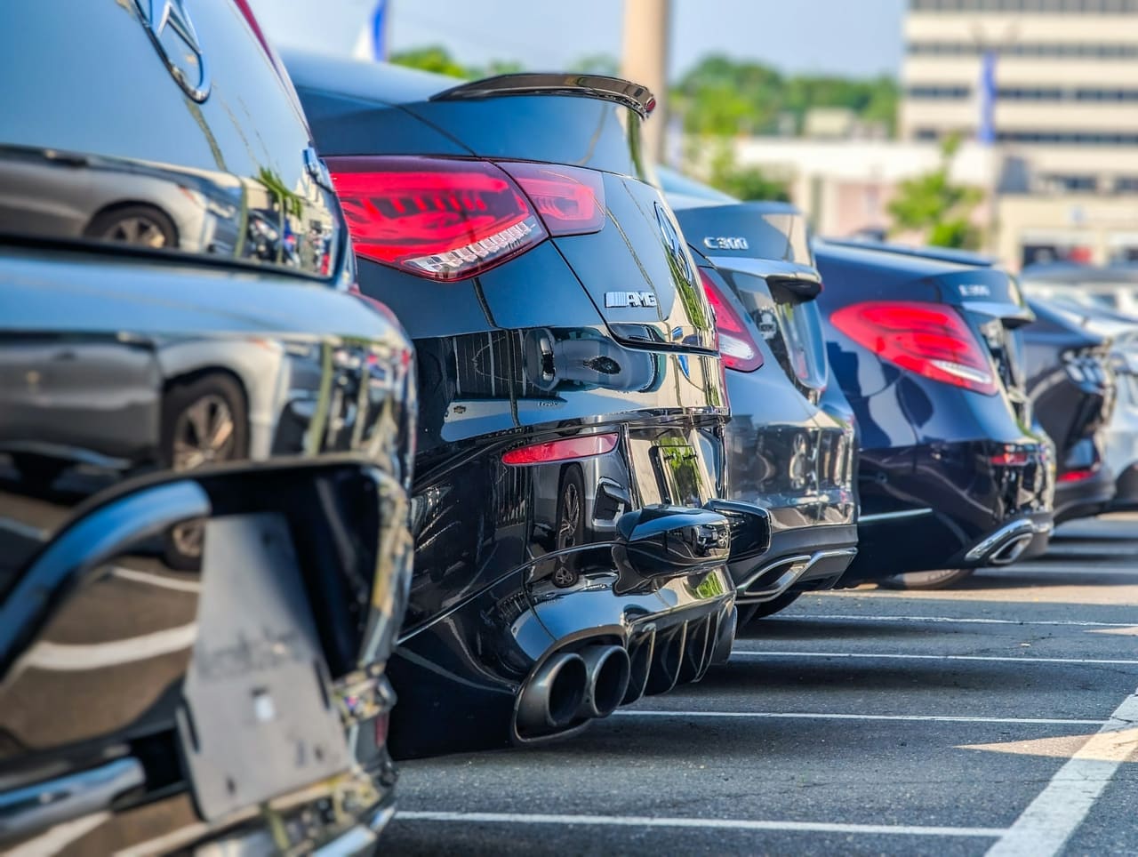 Vehicles lined up on the ground at their destination, ready to be handed over.